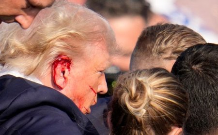 Trump rally shooting: Gunman and audience member dead - as former president injured and rushed off stage