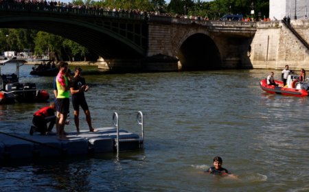 Paris mayor swims in River Seine to prove it’s clean before Olympics