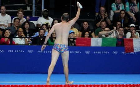 Olympic moment of the day: Cap-catching lifeguard steals the swimming show