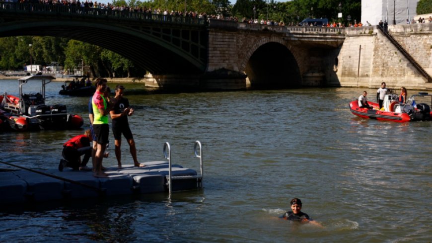 Paris mayor swims in River Seine to prove it’s clean before Olympics