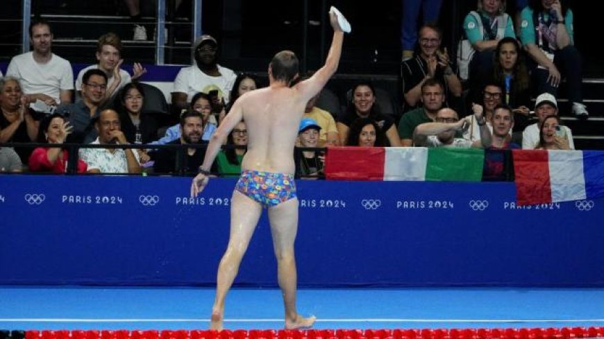 Olympic moment of the day: Cap-catching lifeguard steals the swimming show