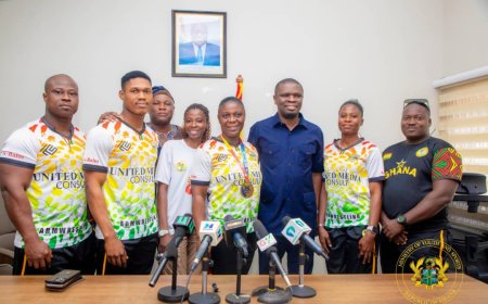 Sports Minister meets World Armwrestling Champion Grace Minta